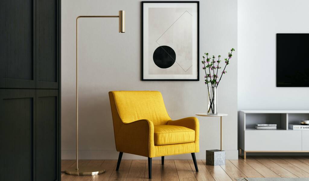 Modern living room with bright yellow arm chair and a fancy picture frame in a cozy home.